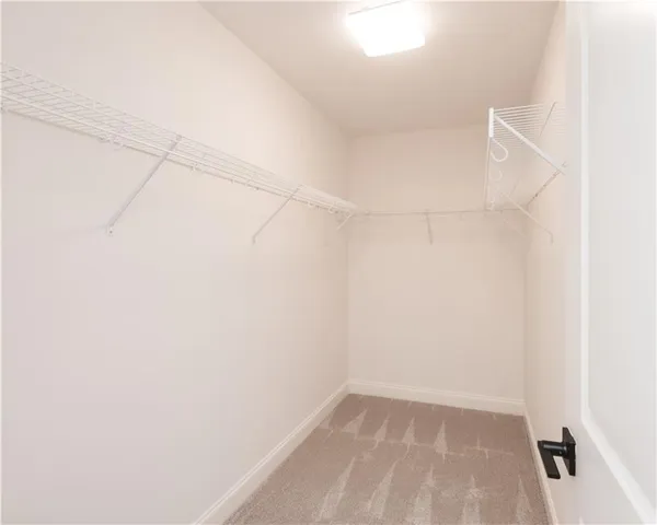 a view of a bathroom from a hallway