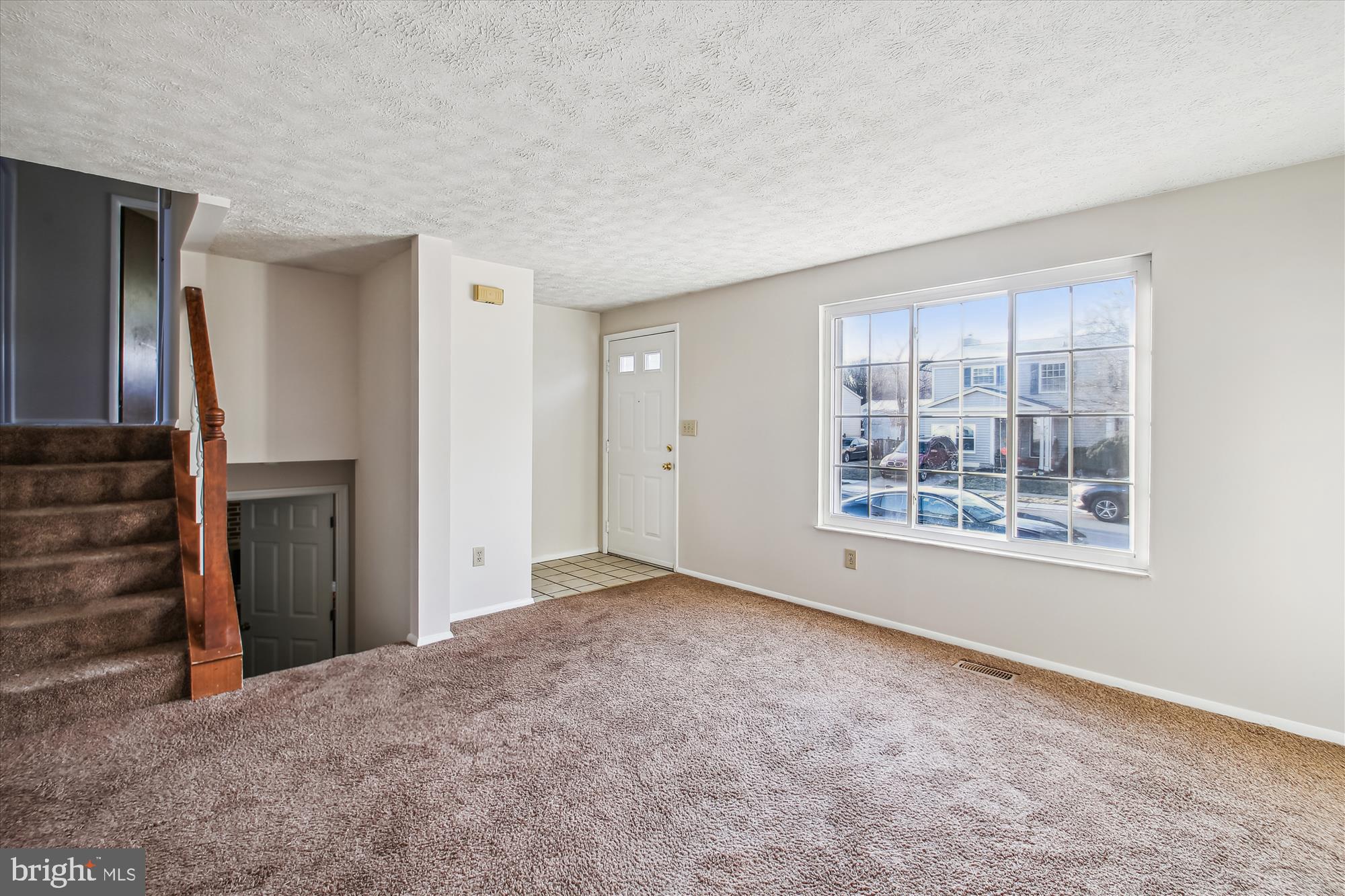 1474 Gesna Drive Hanover, MD 21076 - Photo 11 of 39 a view of an empty room with window and wooden floor