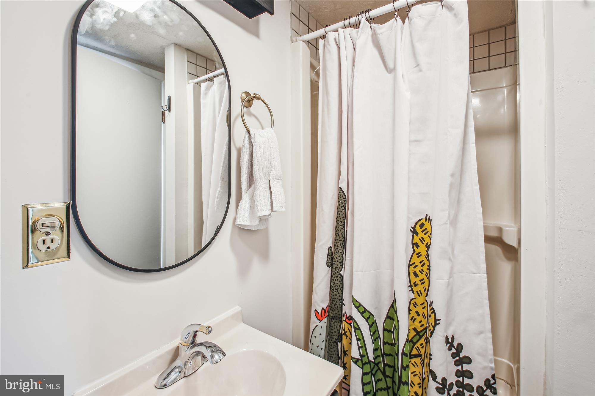 1474 Gesna Drive Hanover, MD 21076 - Photo 22 of 39 a bathroom with a sink and a mirror