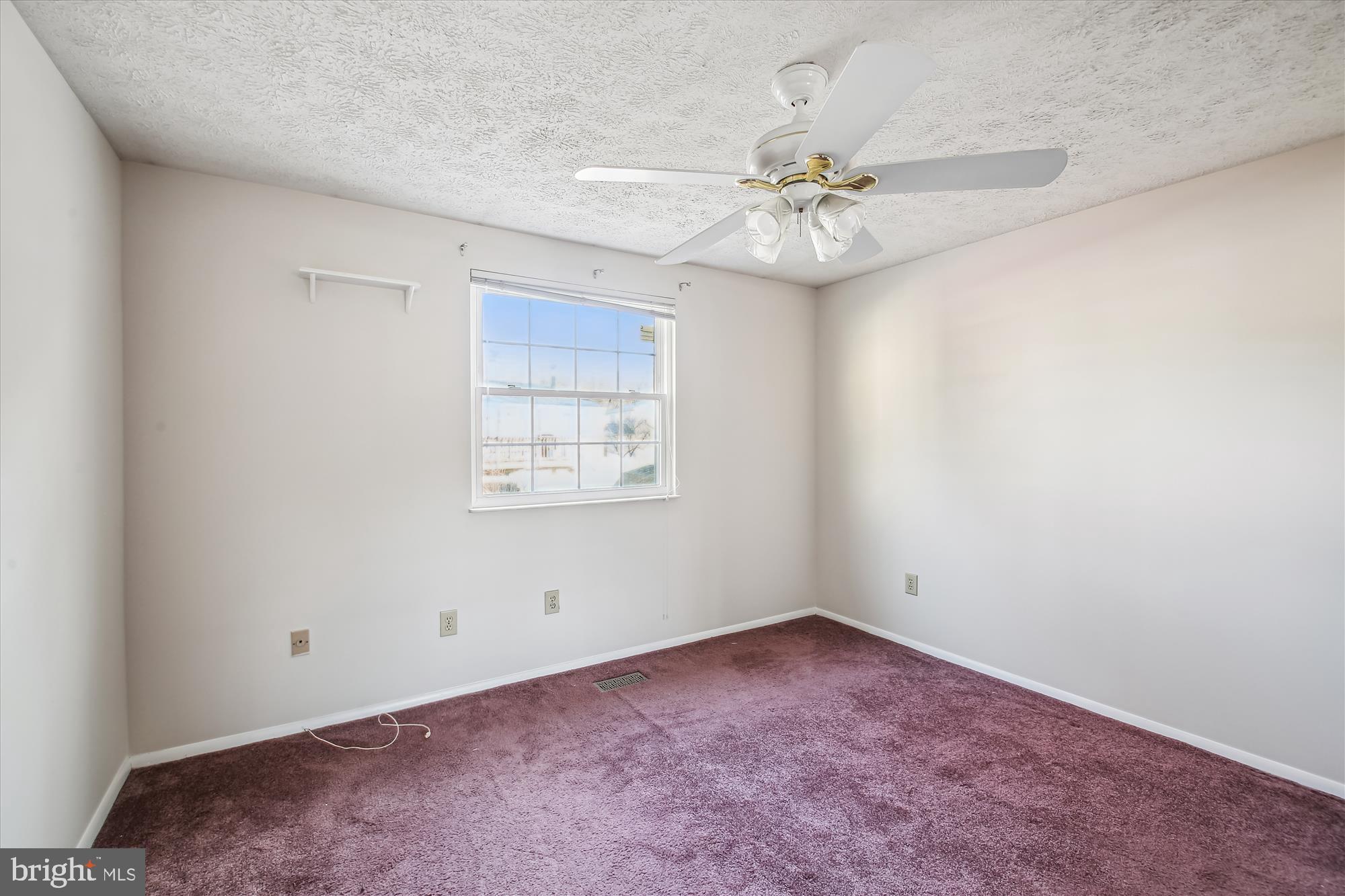 1474 Gesna Drive Hanover, MD 21076 - Photo 24 of 39 an empty room with a window and a fan