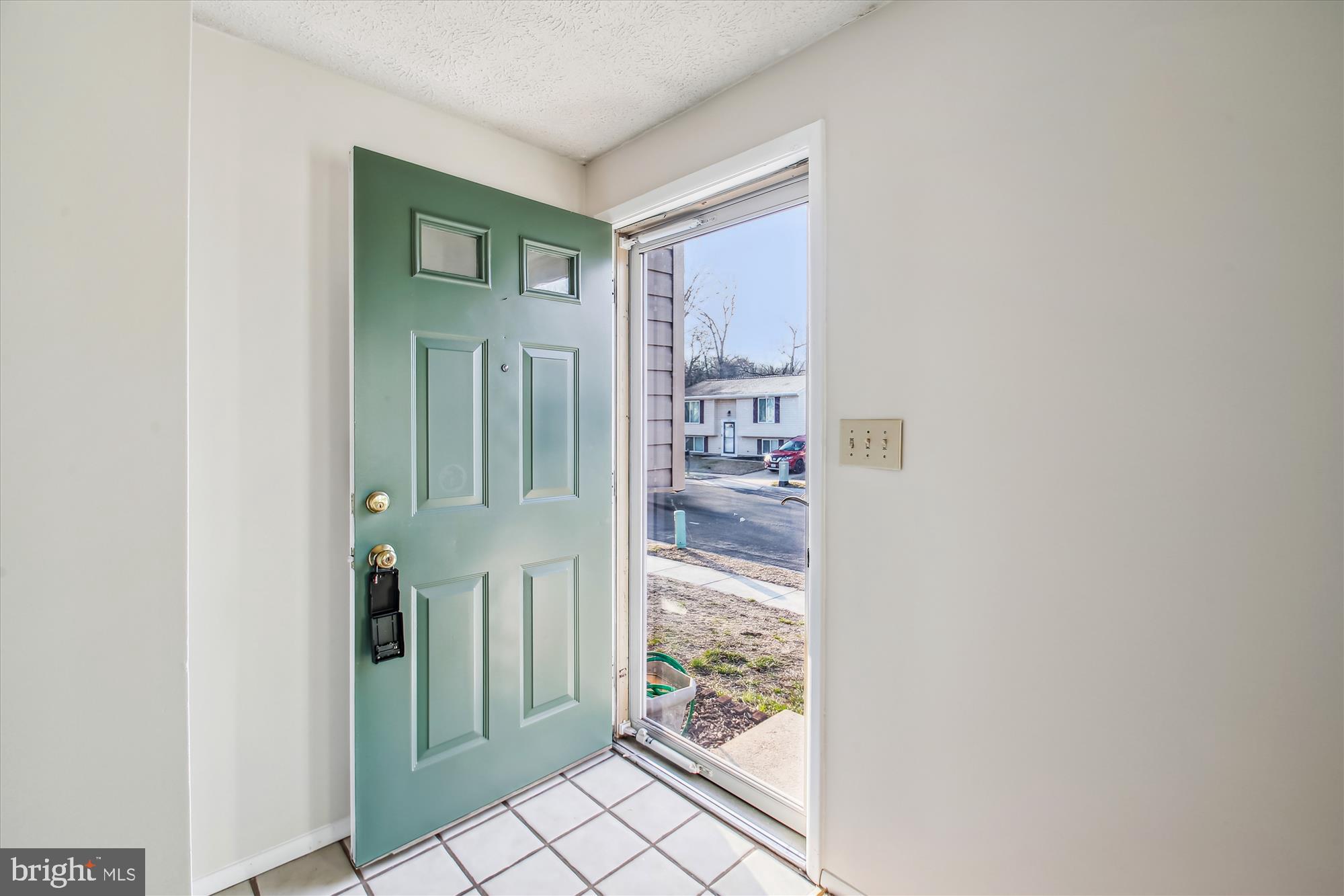 1474 Gesna Drive Hanover, MD 21076 - Photo 8 of 39 a view of a hallway with wooden floor and a bathroom