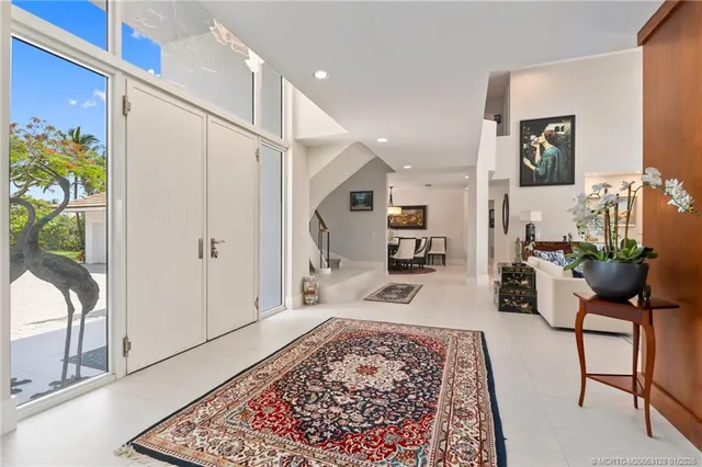 a living room with furniture or couch and a large window