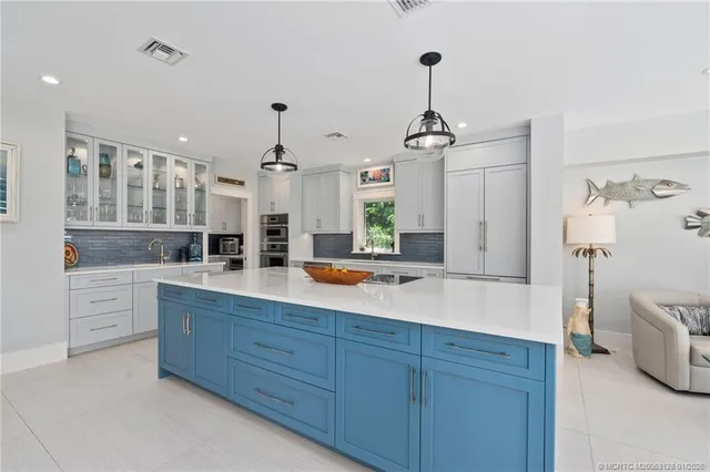 a spacious bathroom with a double vanity sink a mirror and a bathtub