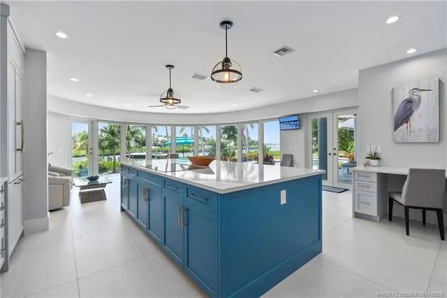 a spacious bathroom with a granite countertop sink mirror and bathtub