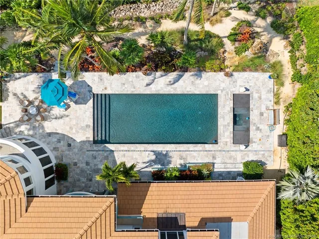 an aerial view of a house with a lake view