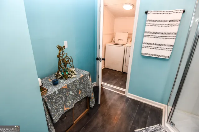 a bathroom with a toilet sink and a mirror