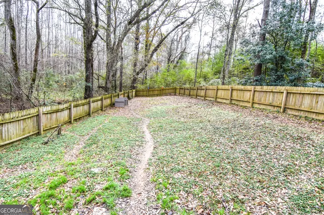 a view of backyard with trees