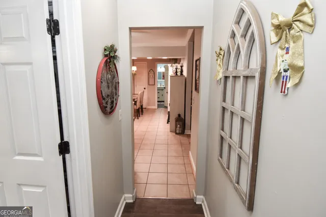 a view of an entryway with wooden floor