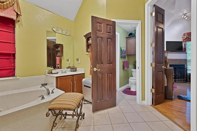 a bathroom with a bathtub and a shower