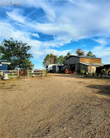 a view of multiple houses with a yard