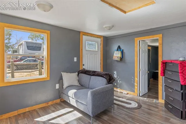 a living room with furniture and a window