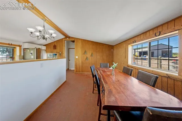 a dining room with furniture and window