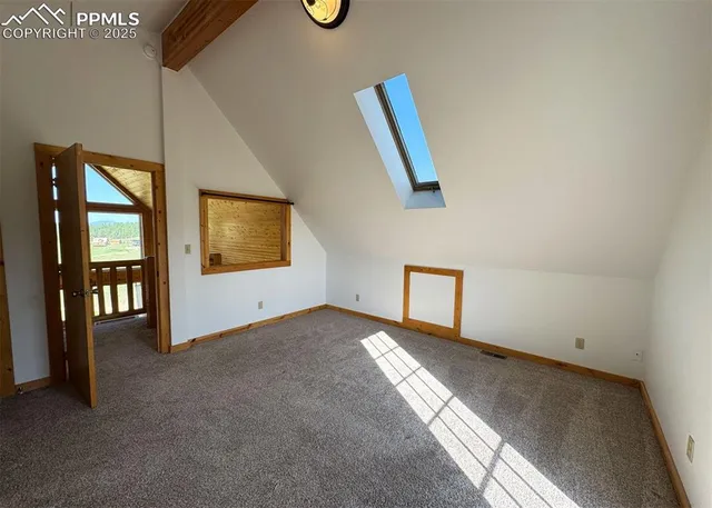 a view of an empty room and glass door