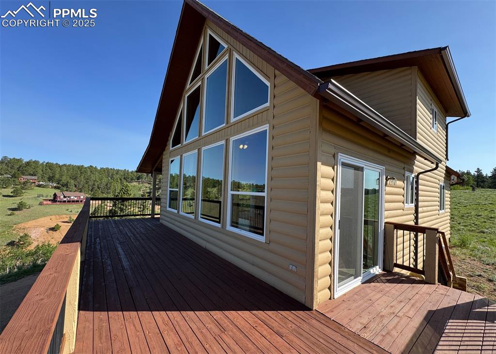 61 Muskrat Lake View Divide, CO 80814 - Photo 3 of 50 a view of balcony with wooden floor and fence
