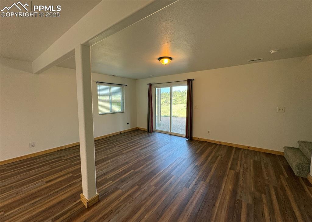 61 Muskrat Lake View Divide, CO 80814 - Photo 34 of 50 a view of an empty room with wooden floor and a window