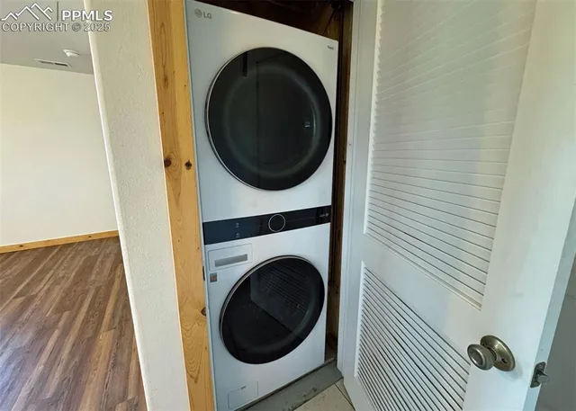 a view of a hallway with washer and dryer