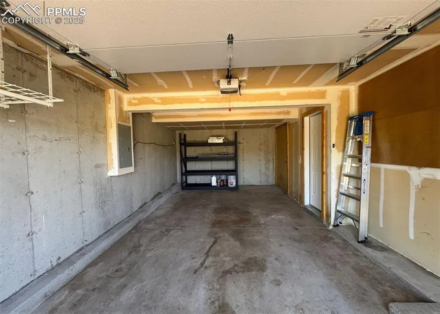 a view of room with a refrigerator and window