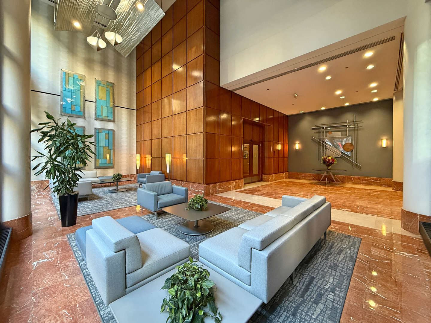 211 East Ohio Street, Unit 2707 Chicago, IL 60611 - Photo 28 of 43 a lobby with furniture and a potted plant