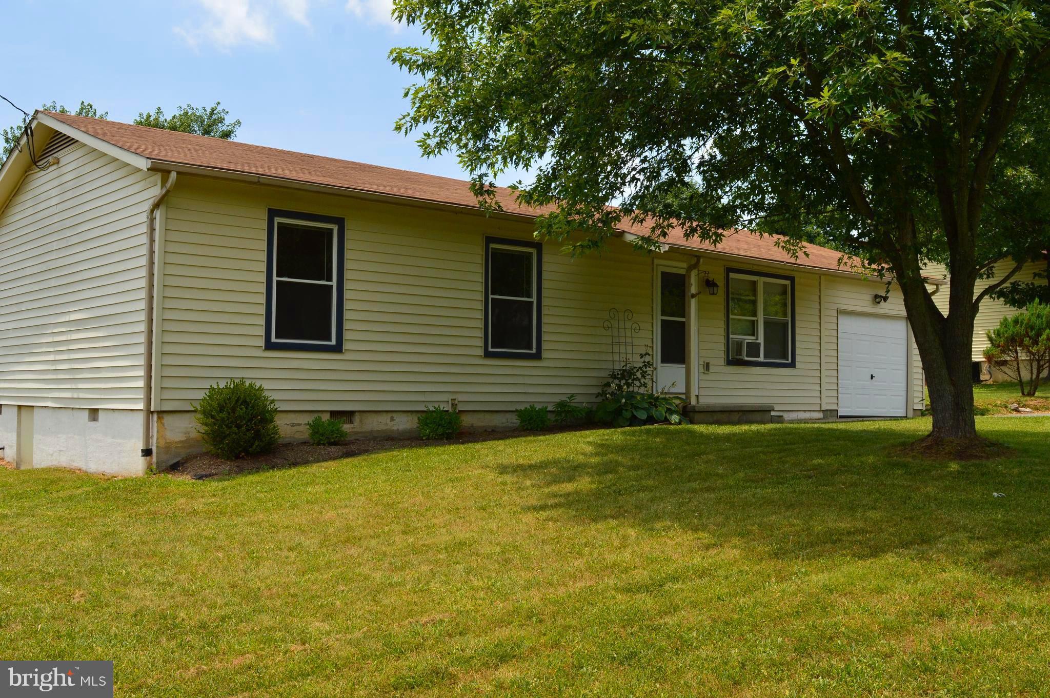96 Harding Lane Inwood, WV 25428 - Photo 1 of 27 a view of a house with a backyard
