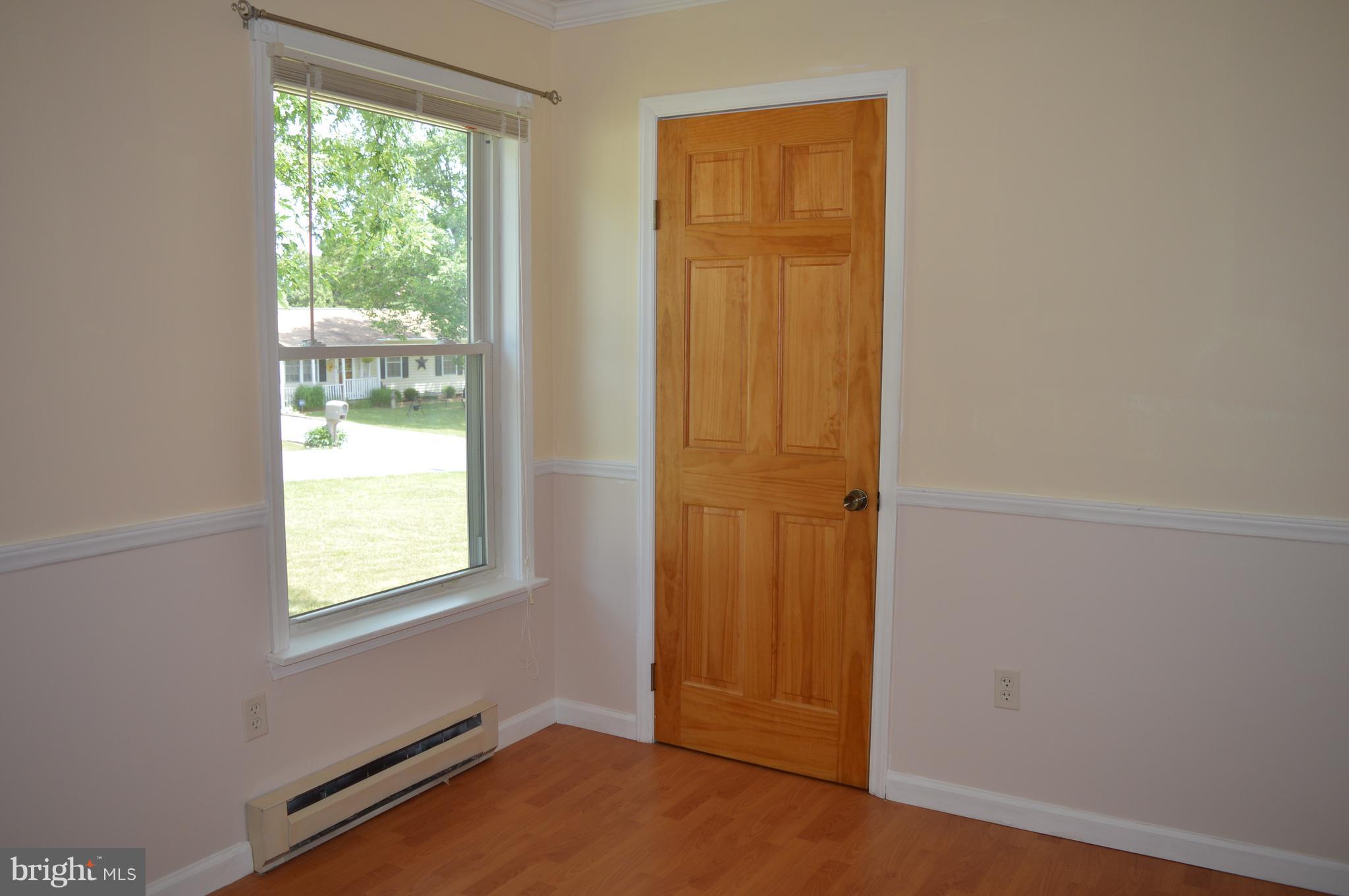 96 Harding Lane Inwood, WV 25428 - Photo 16 of 27 an empty room with windows and closet