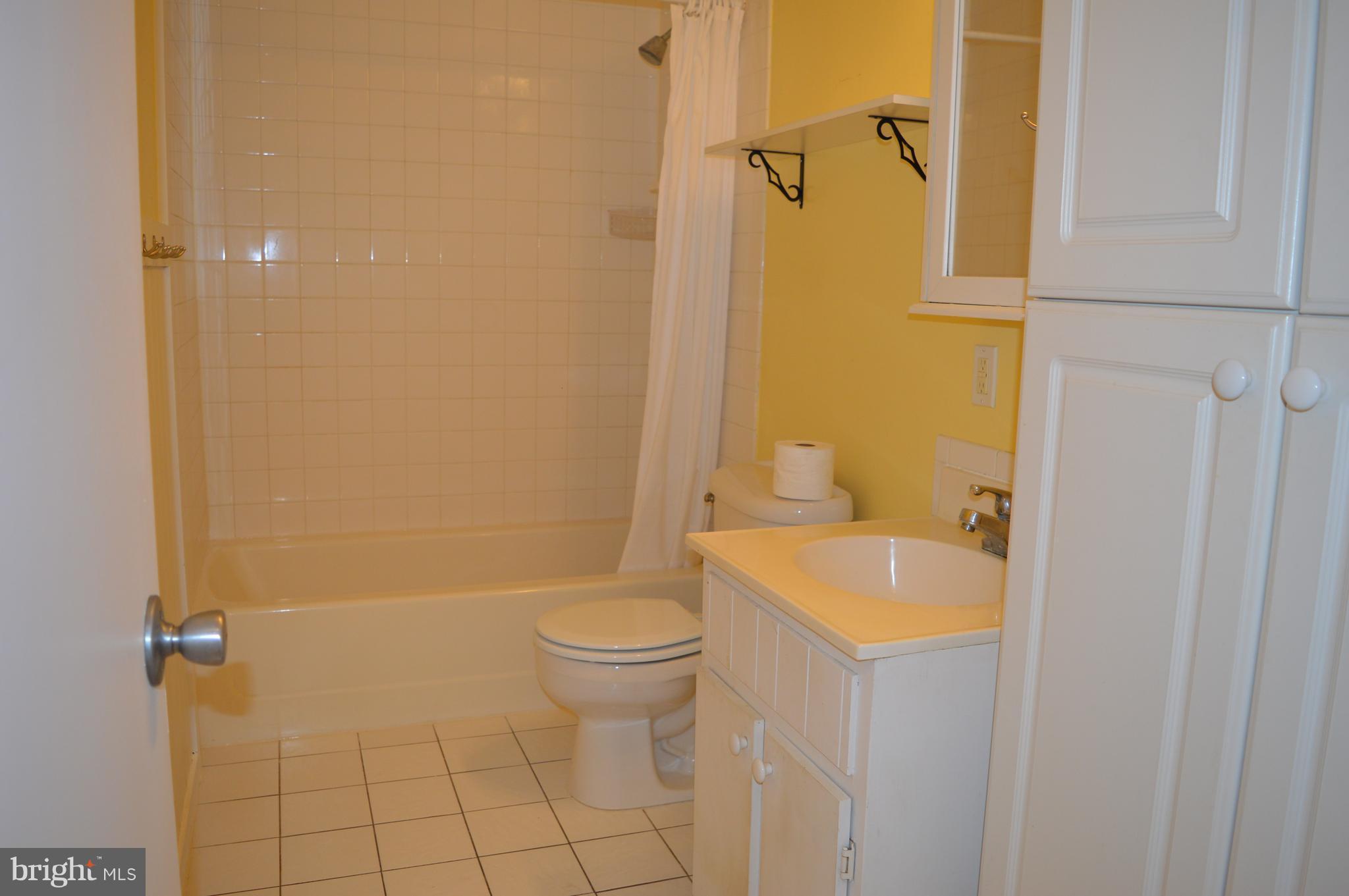 96 Harding Lane Inwood, WV 25428 - Photo 17 of 27 a bathroom with a sink a toilet and shower