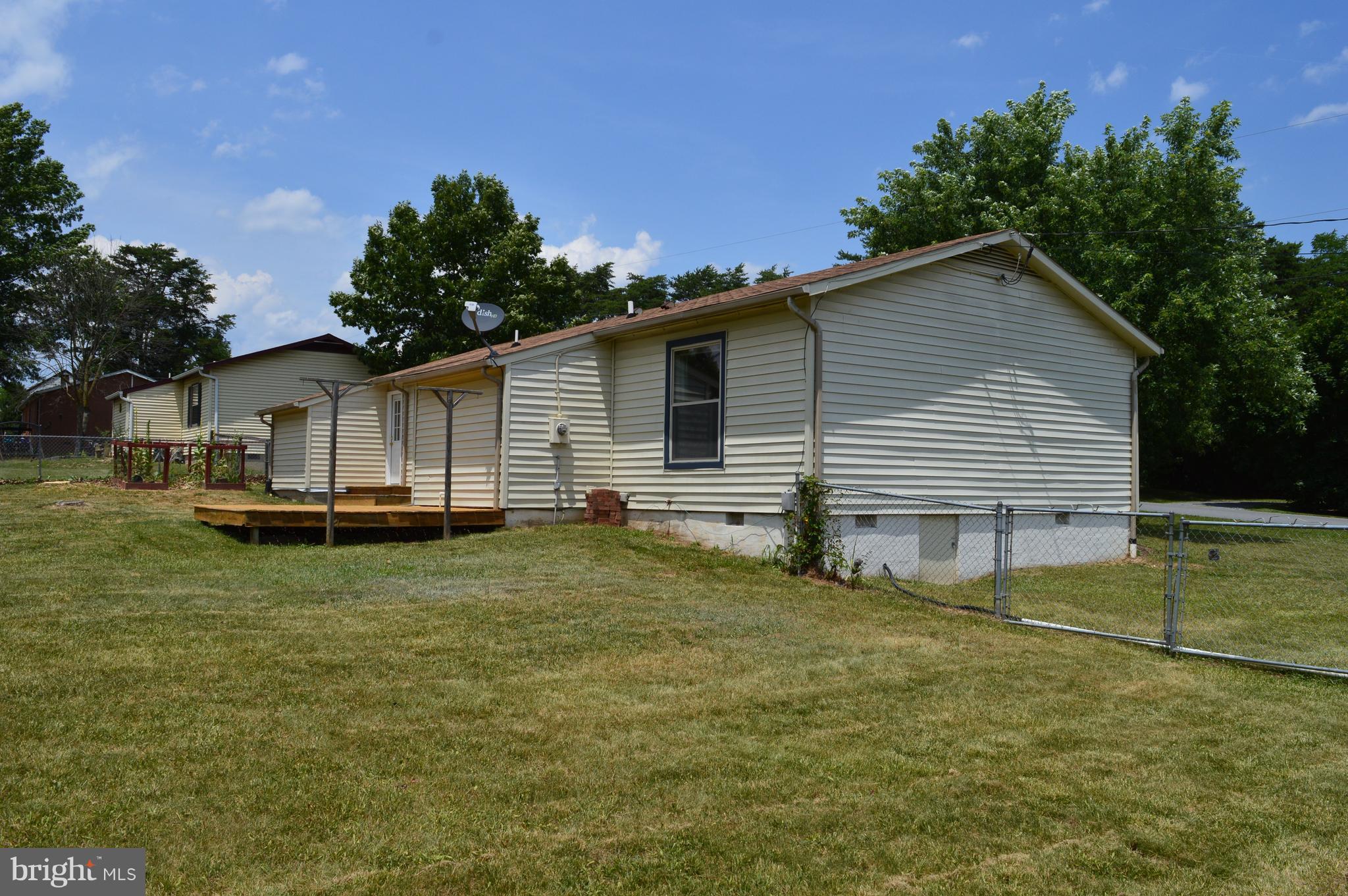96 Harding Lane Inwood, WV 25428 - Photo 25 of 27 a view of a house with a backyard