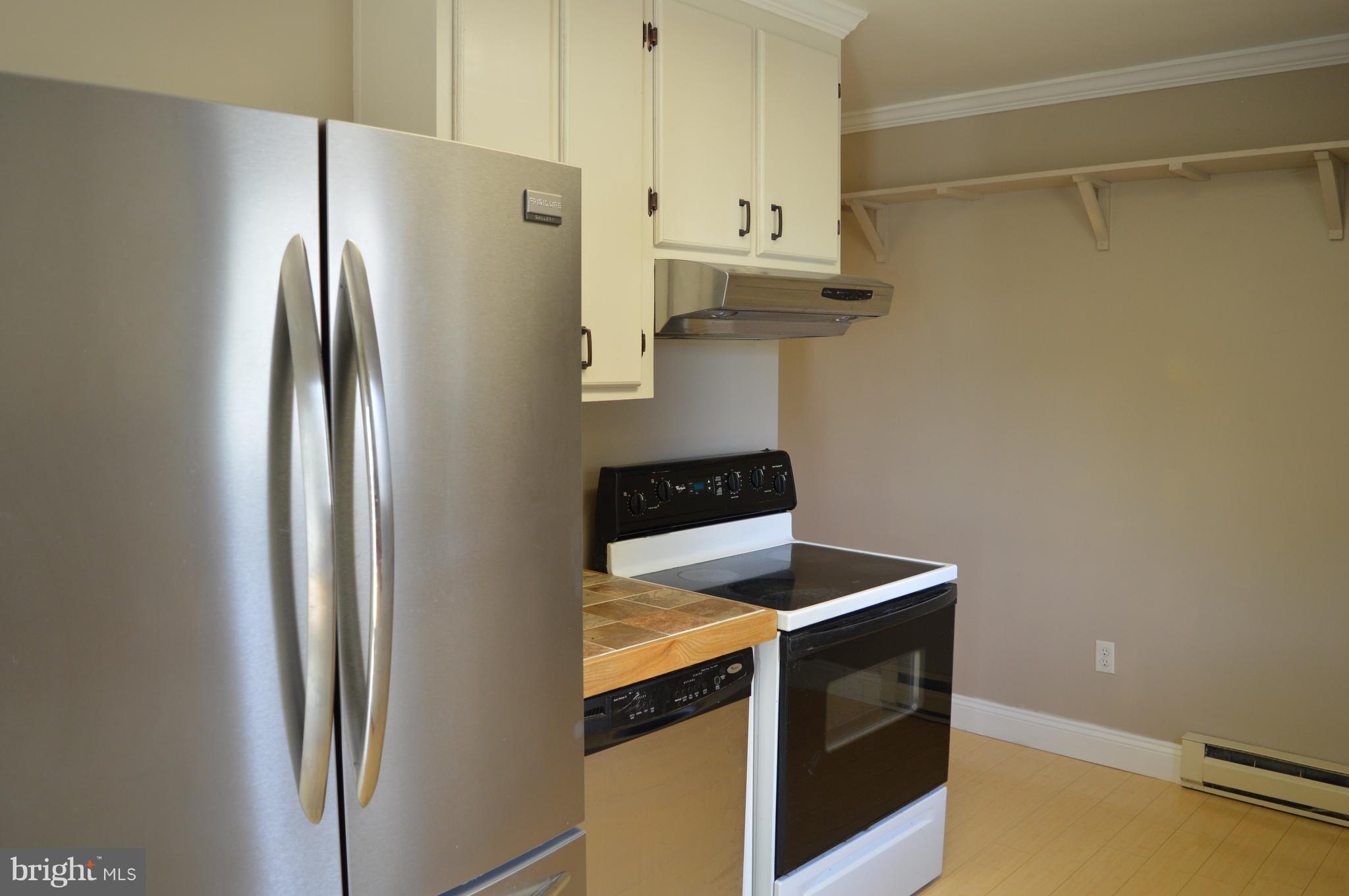 96 Harding Lane Inwood, WV 25428 - Photo 7 of 27 a kitchen with refrigerator and a stove