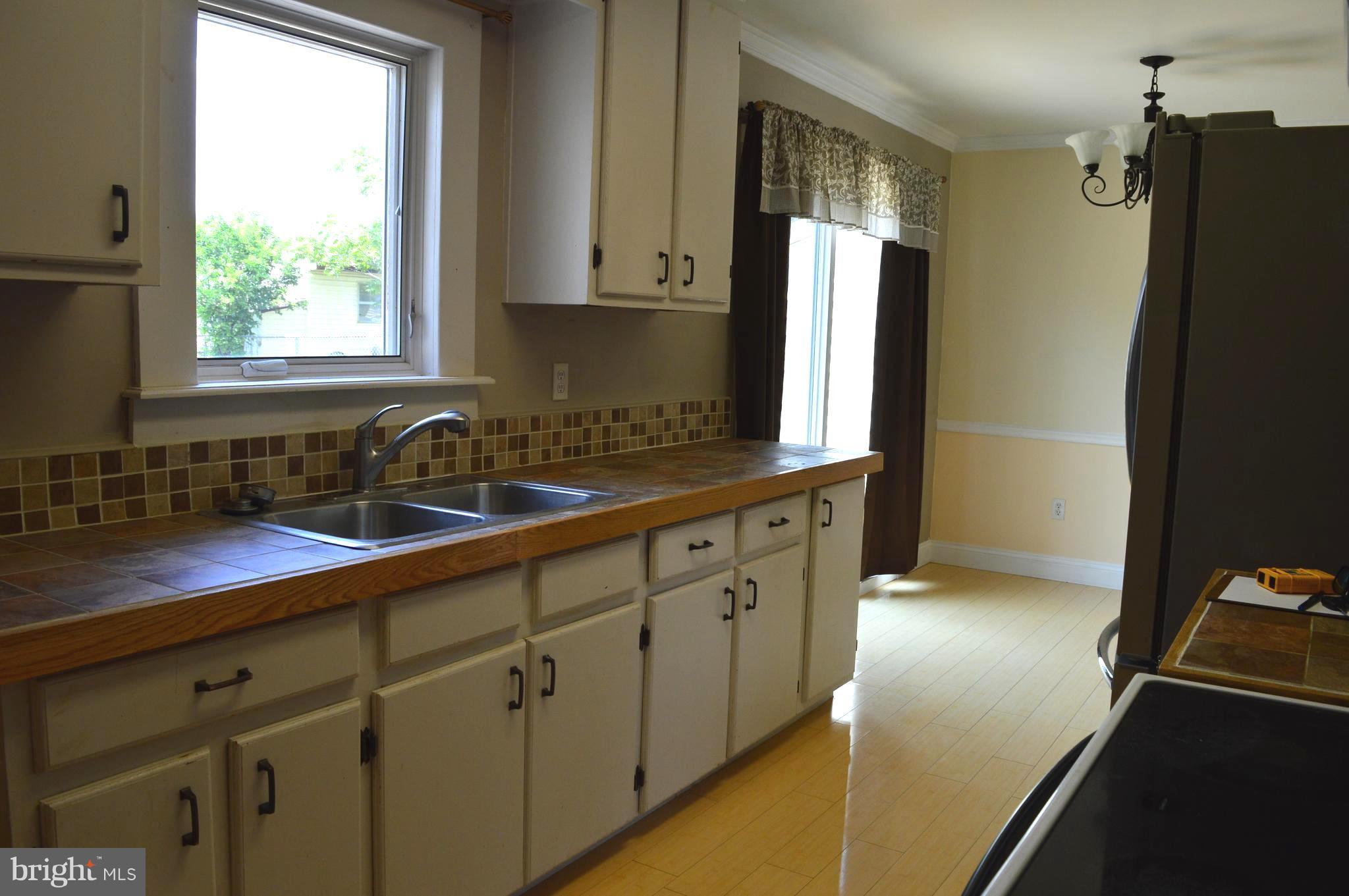 96 Harding Lane Inwood, WV 25428 - Photo 8 of 27 a kitchen with stainless steel appliances granite countertop a refrigerator and a sink