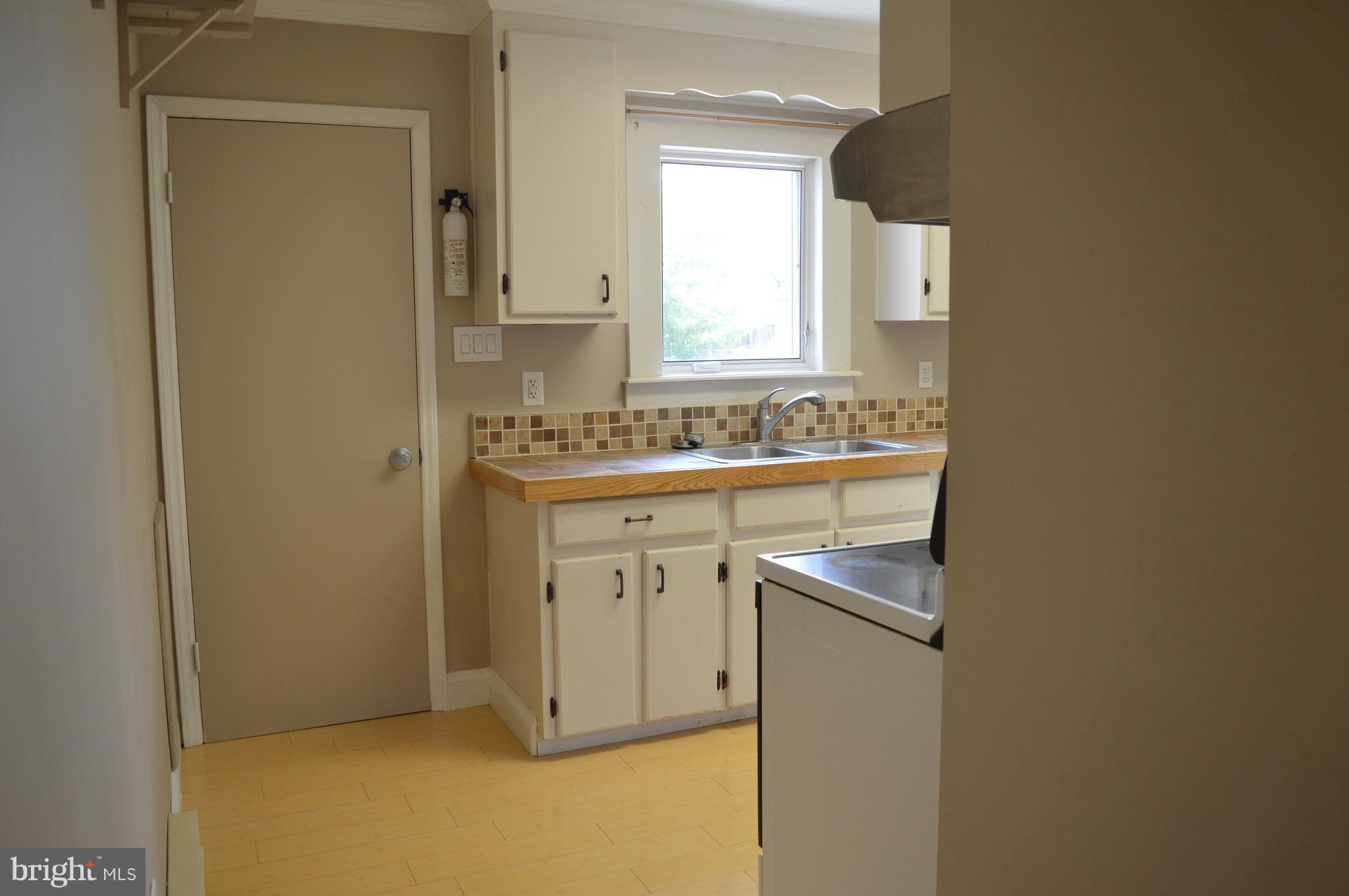 96 Harding Lane Inwood, WV 25428 - Photo 9 of 27 a utility room with a sink a vanity and a mirror