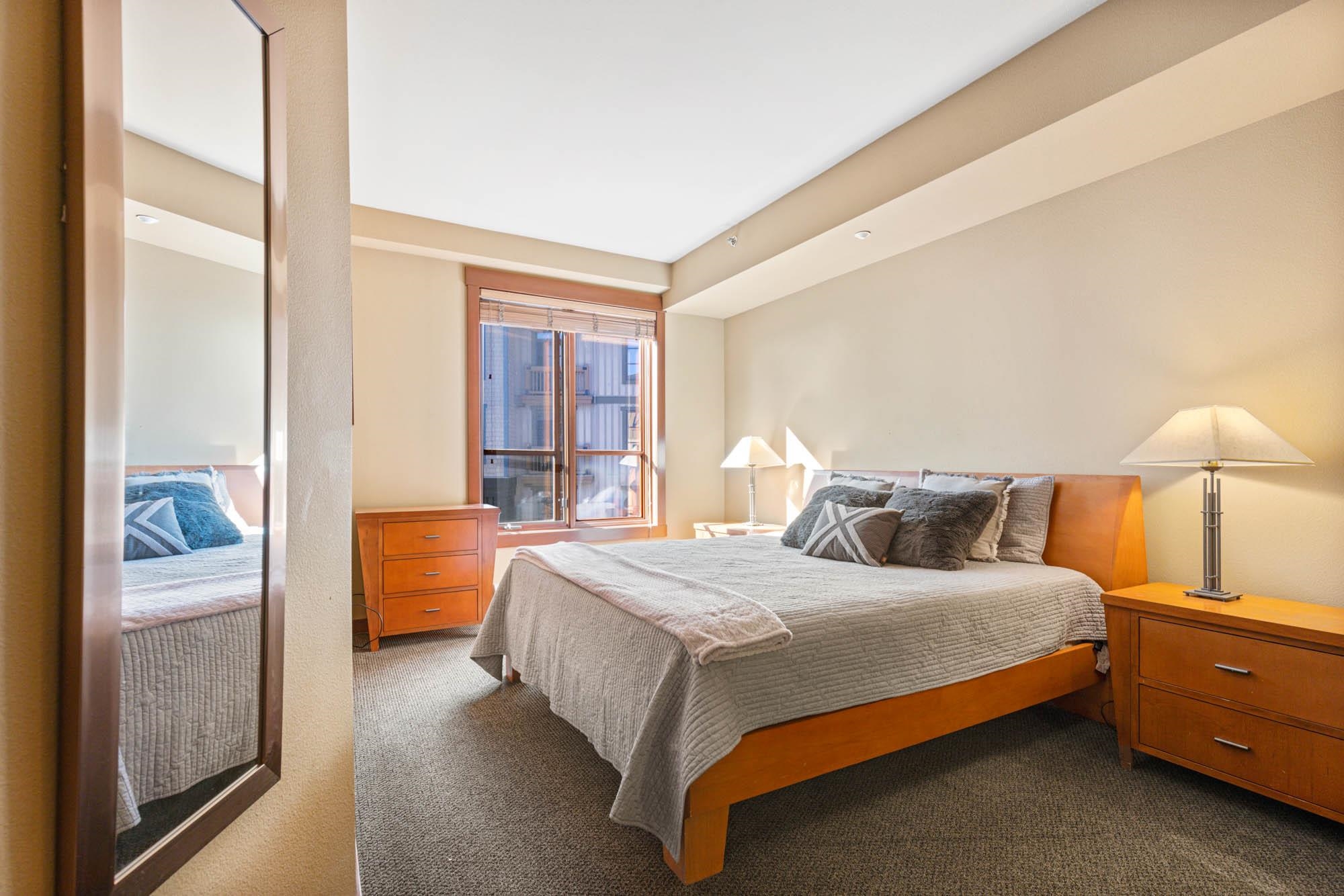 1750 Village East Road, Unit 5306 Olympic Valley, CA 96146 - Photo 13 of 21 a bedroom with a bed and a window