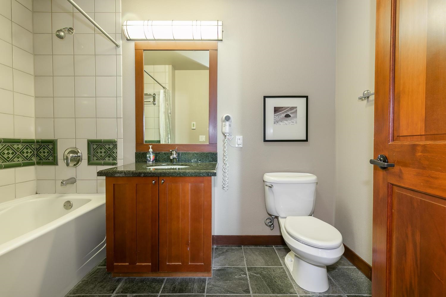1750 Village East Road, Unit 5306 Olympic Valley, CA 96146 - Photo 14 of 21 a bathroom with a toilet a sink and bathtub