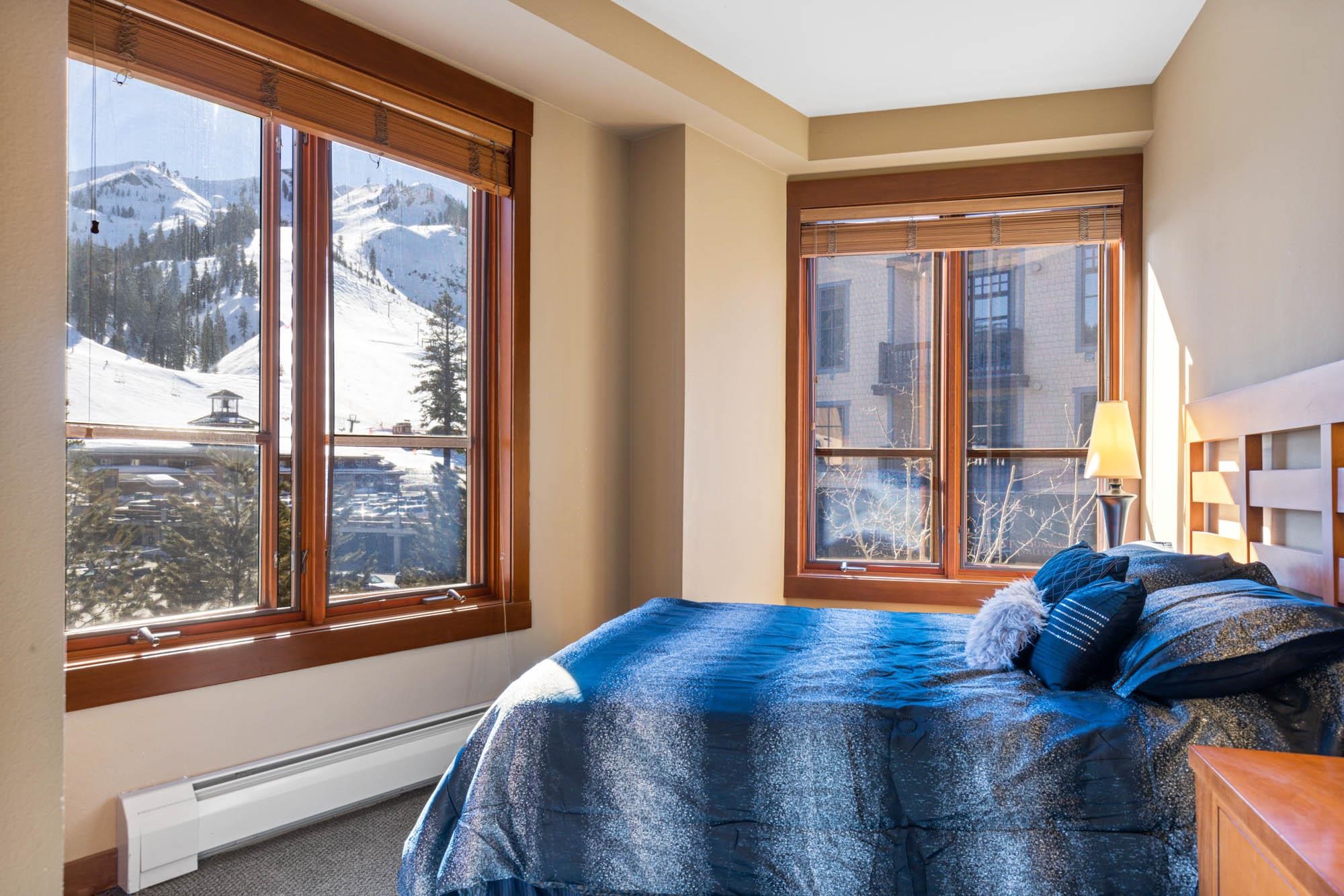 1750 Village East Road, Unit 5306 Olympic Valley, CA 96146 - Photo 15 of 21 a bedroom with a bed and a large window