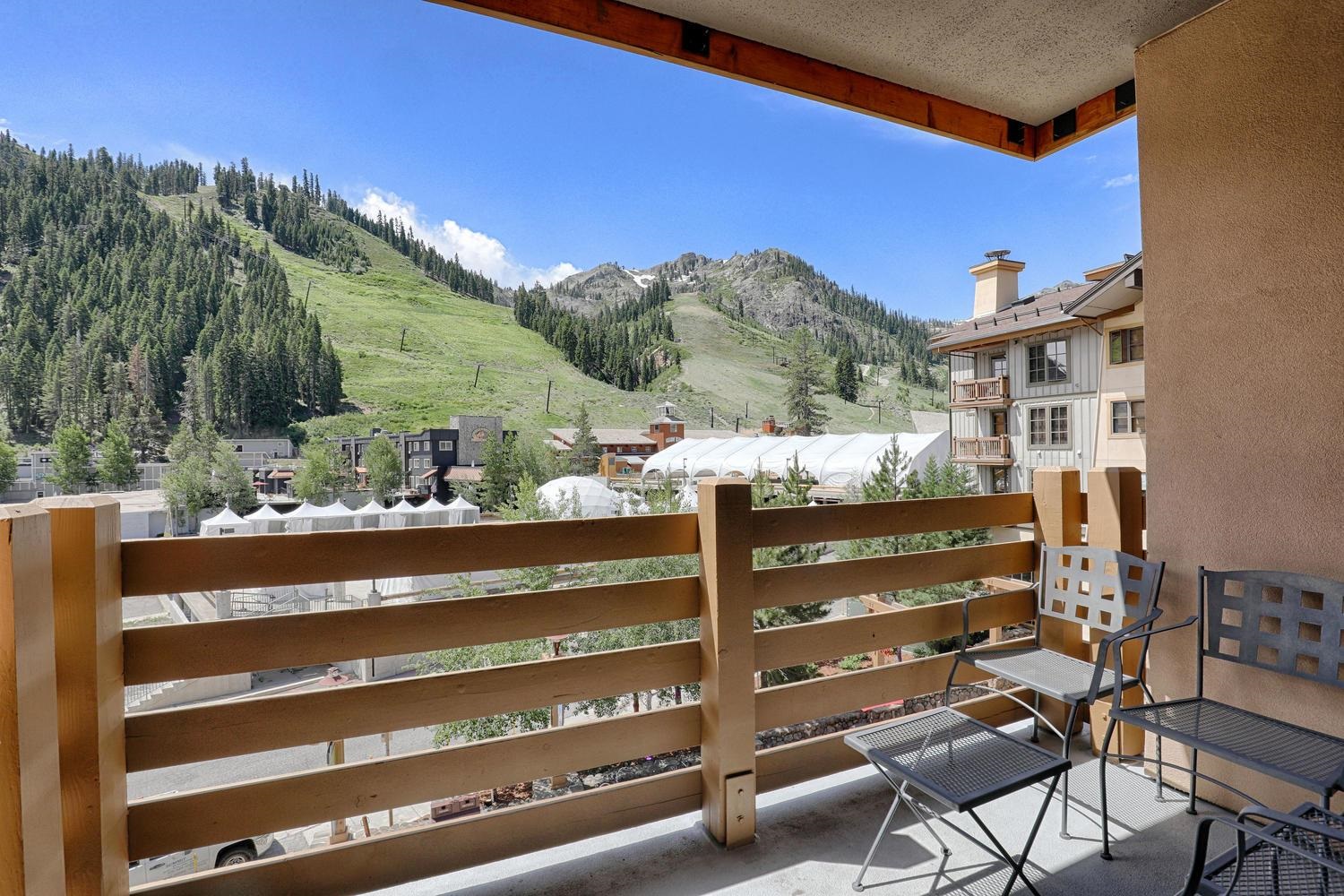 1750 Village East Road, Unit 5306 Olympic Valley, CA 96146 - Photo 20 of 21 a view of a chairs and table in a backyard