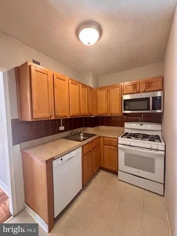 a kitchen with a stove and a microwave