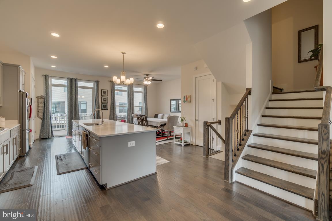 44721 Ellsworth Terrace Ashburn, VA 20147 - Photo 11 of 51 a living room with furniture and a chandelier