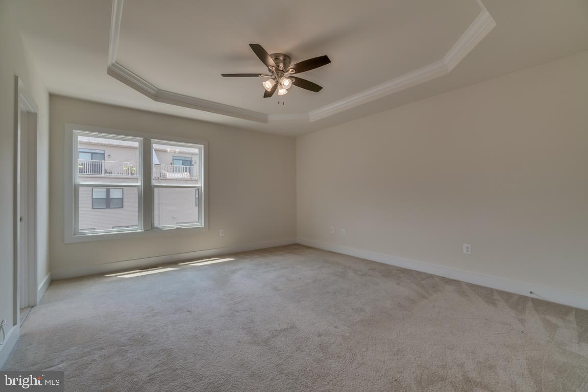 44721 Ellsworth Terrace Ashburn, VA 20147 - Photo 17 of 51 an empty room with ceiling fan and windows