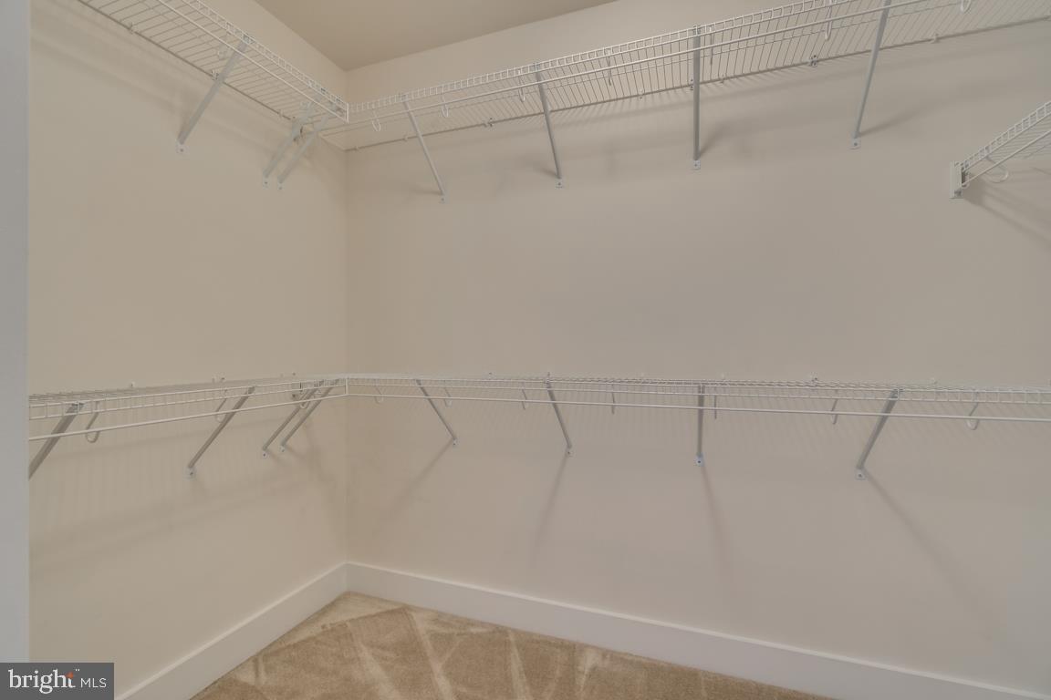 44721 Ellsworth Terrace Ashburn, VA 20147 - Photo 20 of 51 a view of a room with racks on the wall