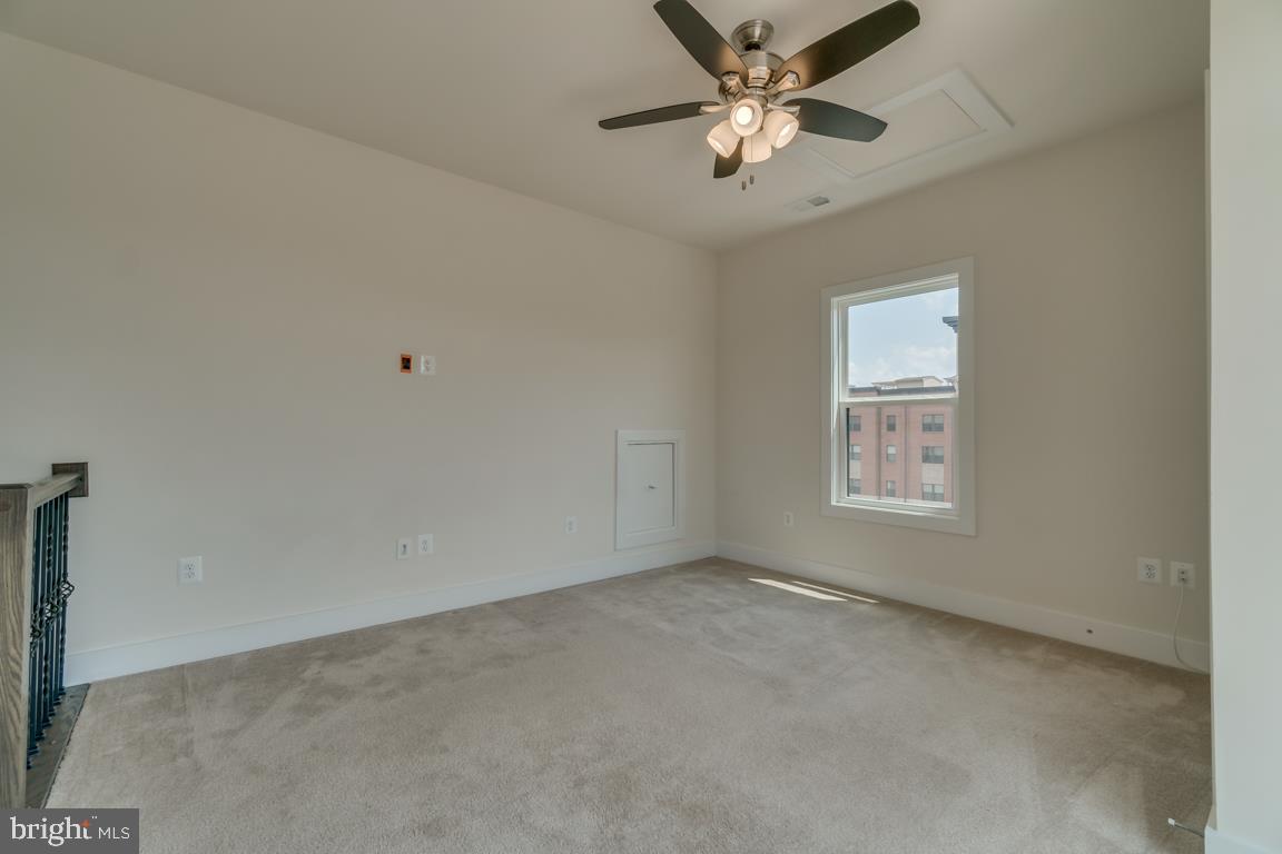 44721 Ellsworth Terrace Ashburn, VA 20147 - Photo 33 of 51 an empty room with a window and a fan