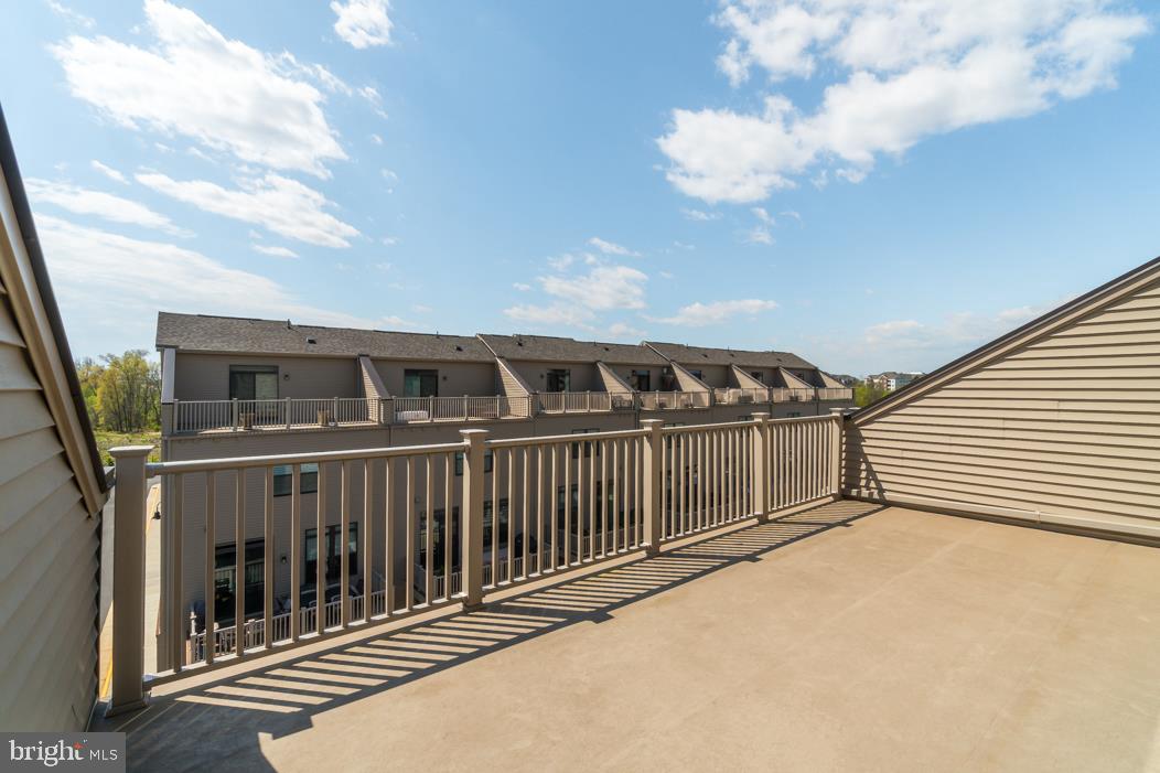 44721 Ellsworth Terrace Ashburn, VA 20147 - Photo 37 of 51 a view of a house with a balcony