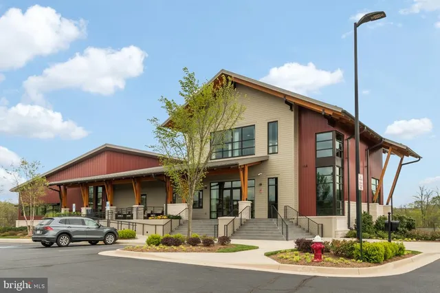 a terrace with outdoor seating and city view