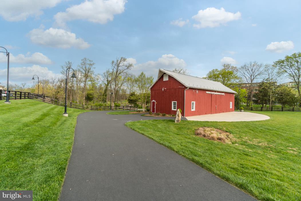 44721 Ellsworth Terrace Ashburn, VA 20147 - Photo 49 of 51 a view of a house with a yard