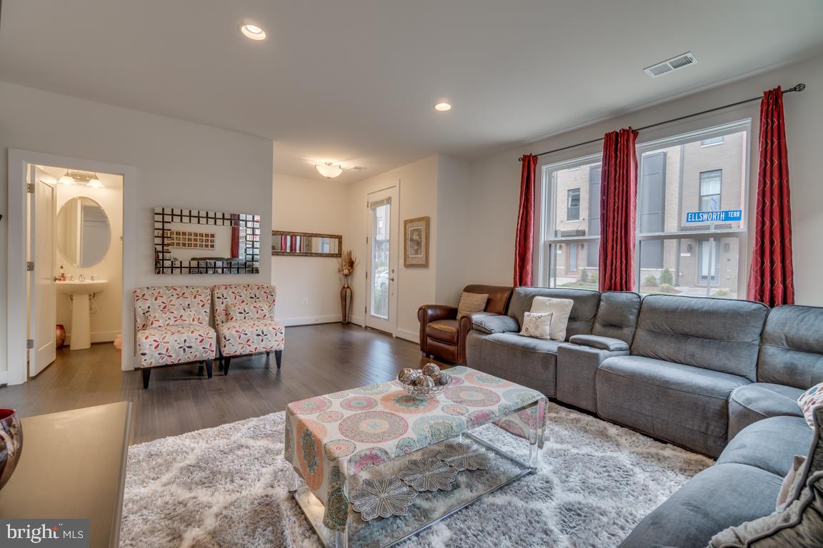 44721 Ellsworth Terrace Ashburn, VA 20147 - Photo 5 of 51 a living room with furniture and a large window