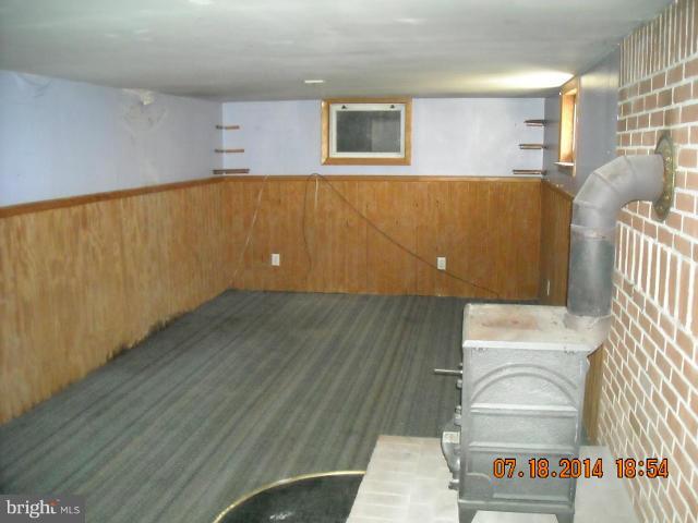 7338 Montgomery Road Elkridge, MD 21075 - Photo 4 of 8 a view of an empty room and wooden floor