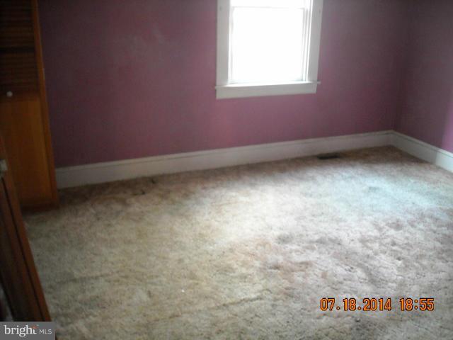 7338 Montgomery Road Elkridge, MD 21075 - Photo 6 of 8 an empty room with a window