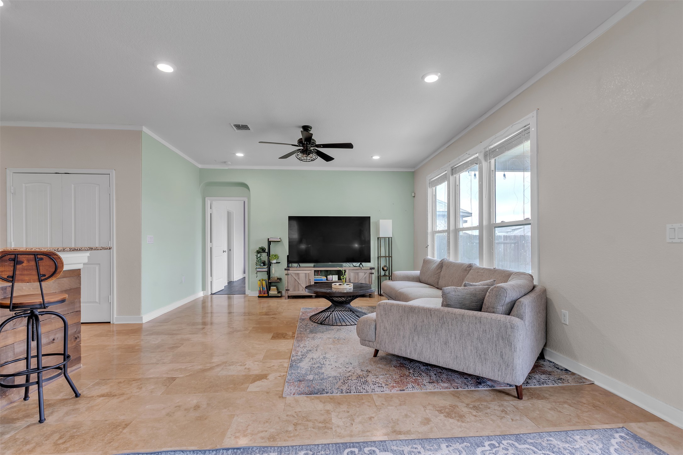 128 Kavanaugh Street Georgetown, TX 78628 - Photo 4 of 13 Spacious living area featuring light-toned flooring, recessed lighting, and a ceiling fan