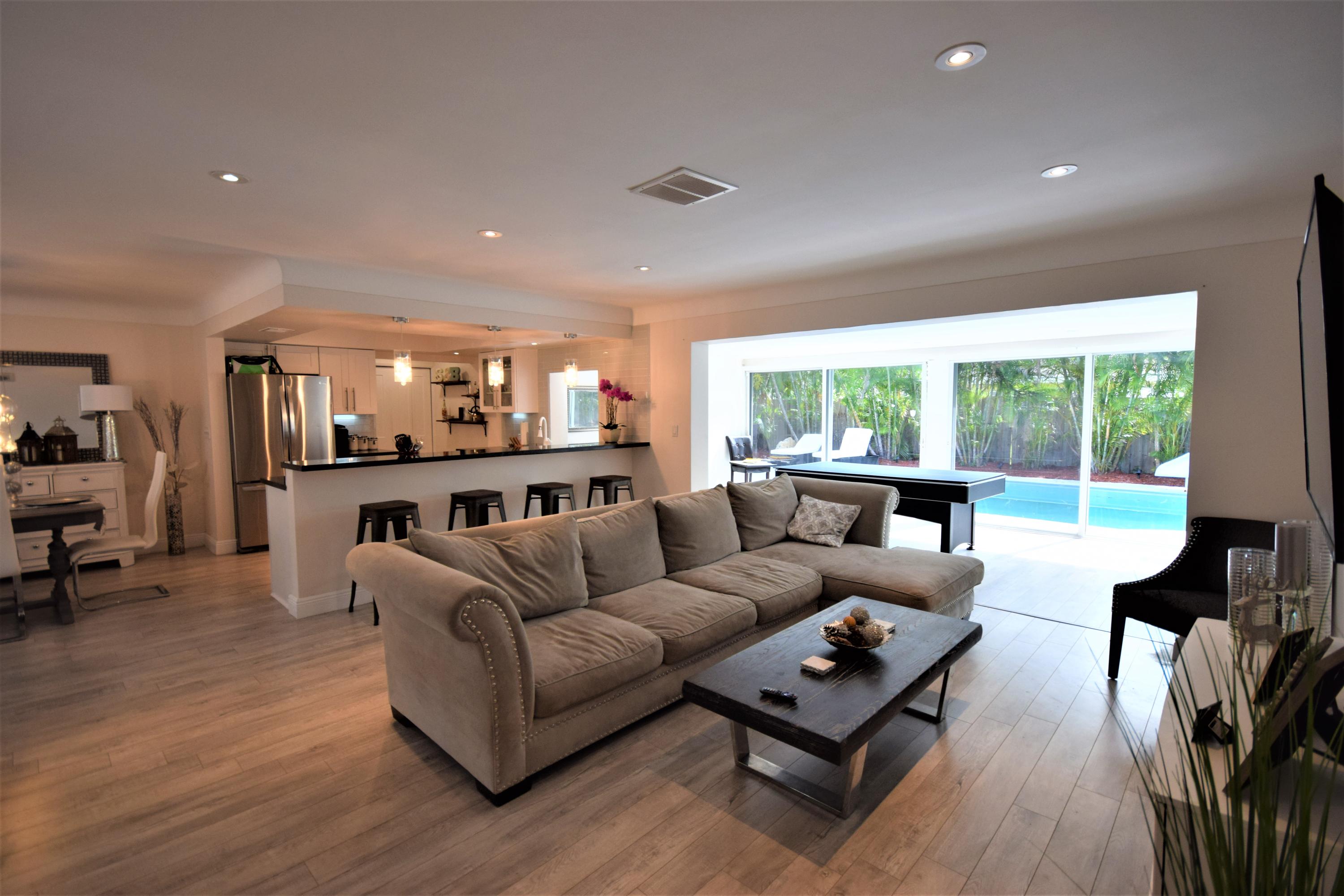 2770 Northeast 25th Terrace Boca Raton, FL 33431 - Photo 24 of 34 a living room with furniture and a large window