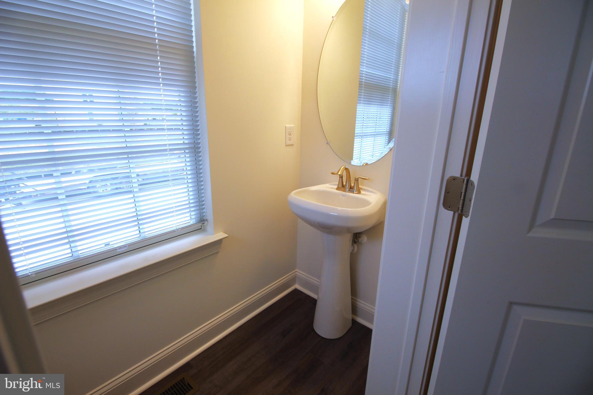 851 Mapleton Avenue Middletown, DE 19709 - Photo 12 of 25 a view of bathroom with a sink and mirror