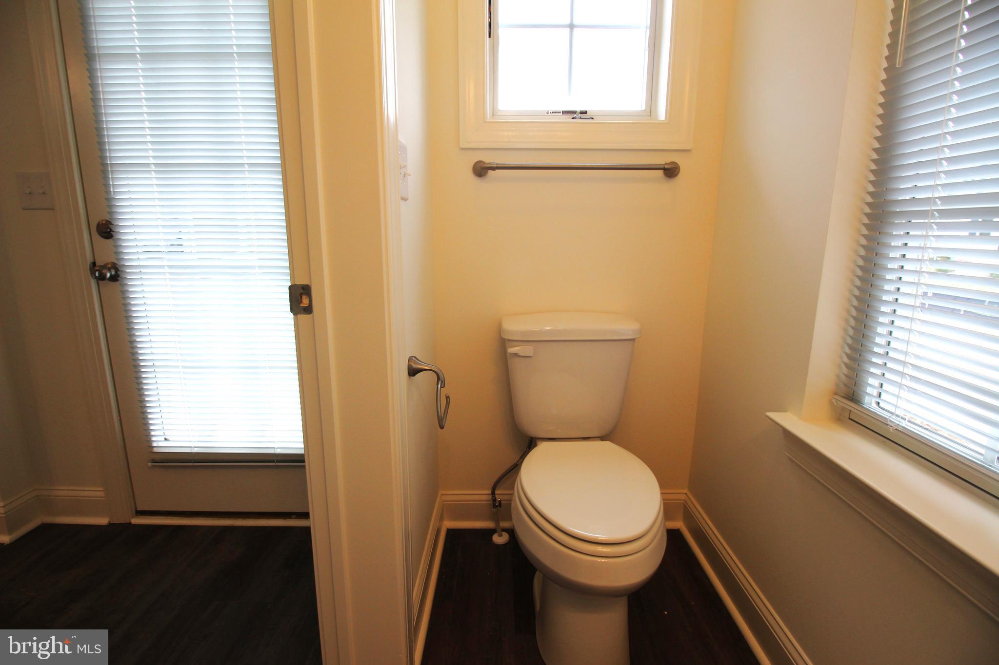 851 Mapleton Avenue Middletown, DE 19709 - Photo 13 of 25 a bathroom with a toilet and a window