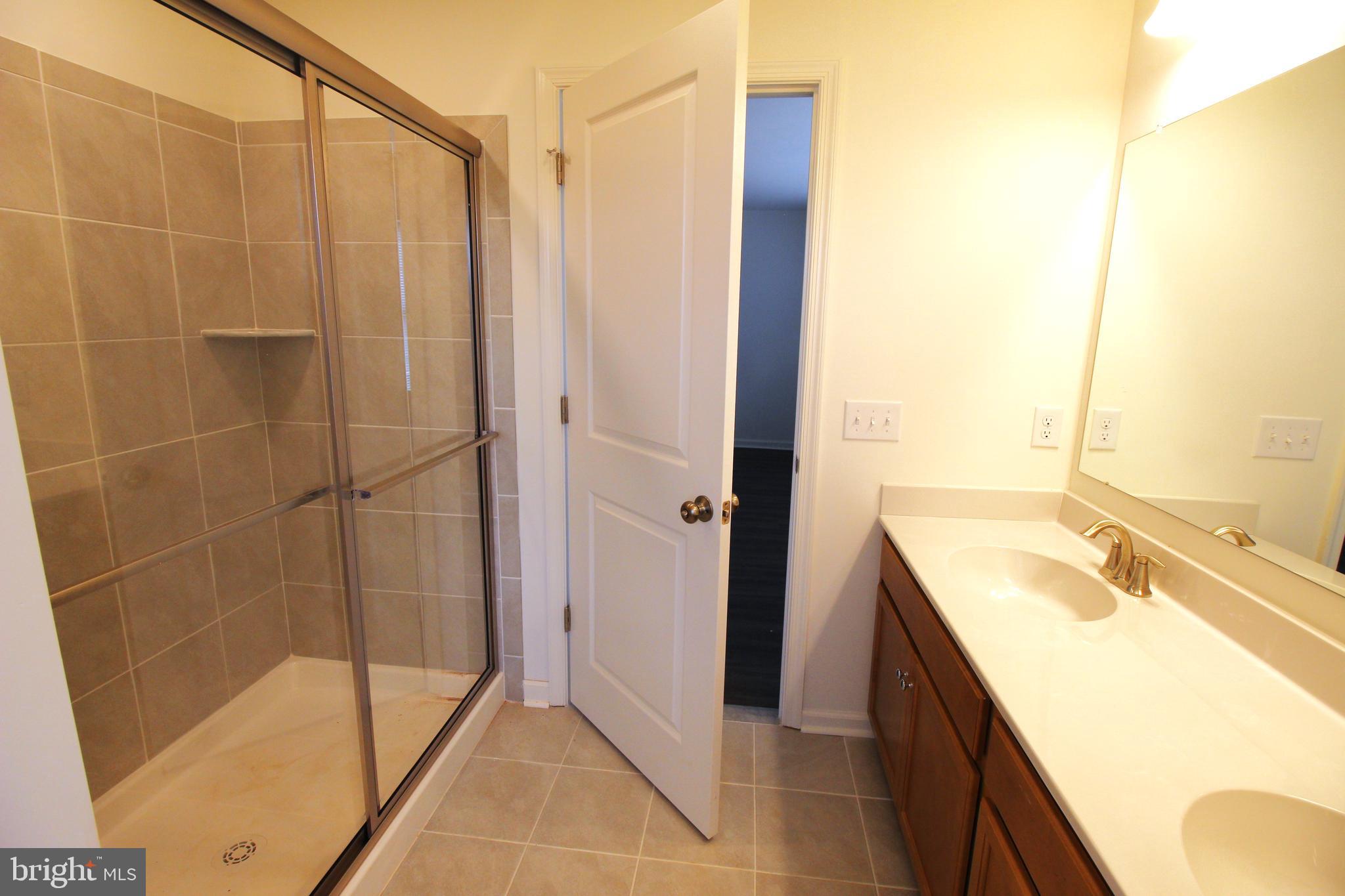 851 Mapleton Avenue Middletown, DE 19709 - Photo 20 of 26 a bathroom with a tub sink and shower