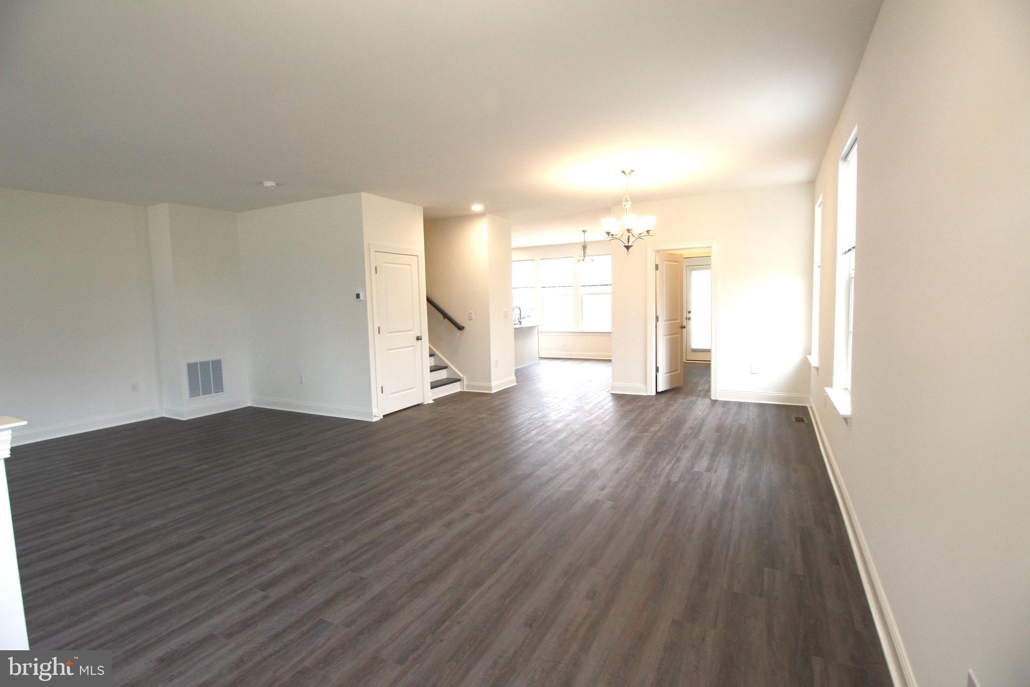 851 Mapleton Avenue Middletown, DE 19709 - Photo 7 of 25 a view of empty room with wooden floor